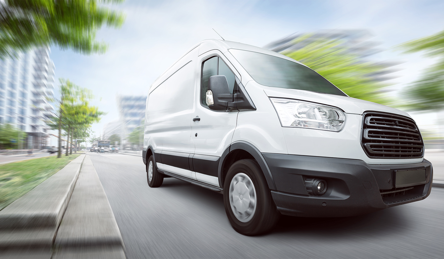 a white van driving down the road