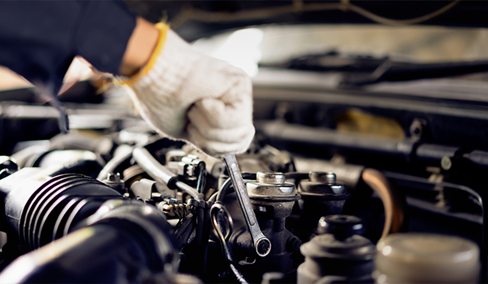 a hand holding a wrench