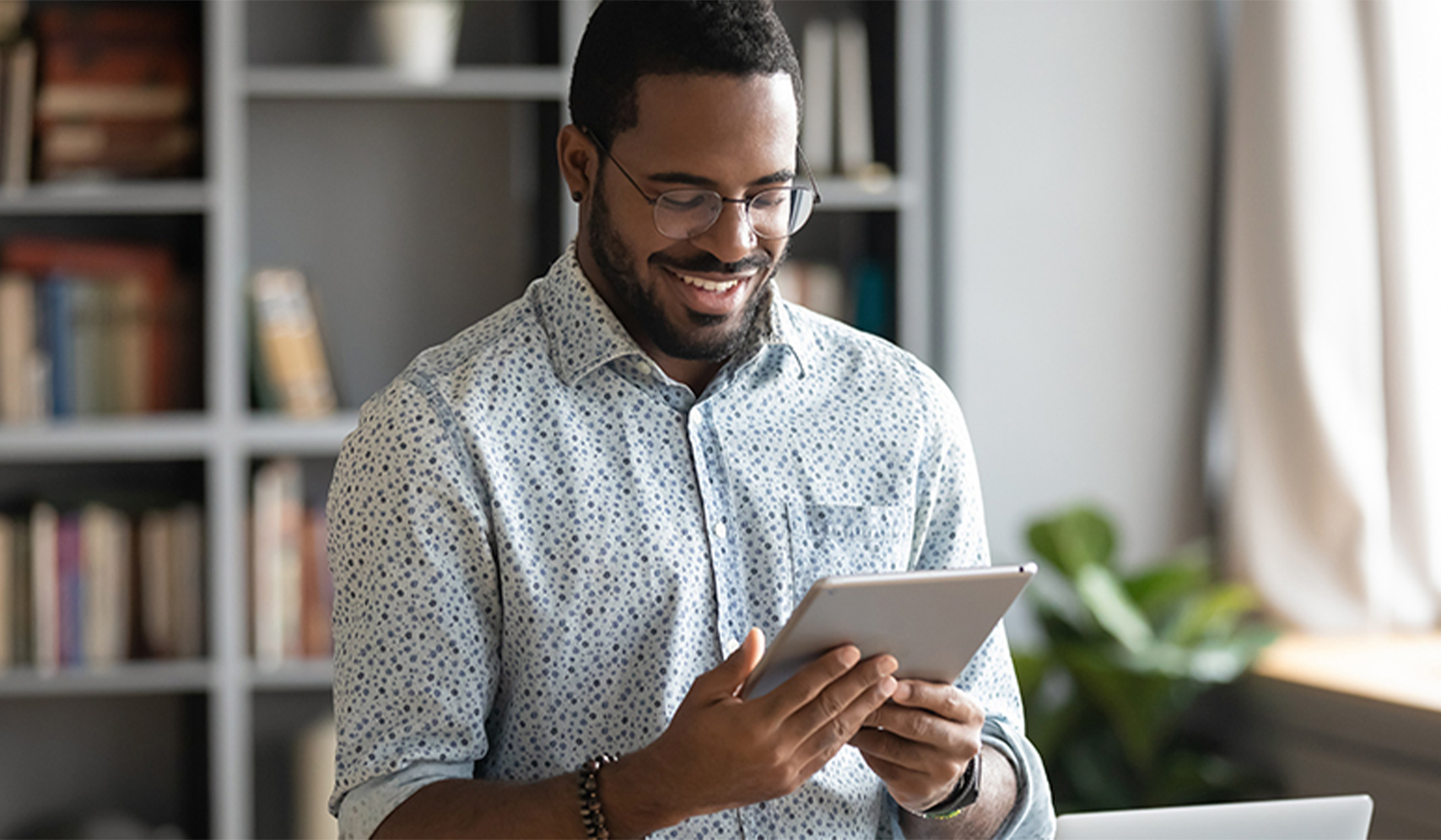 a man holding a tablet