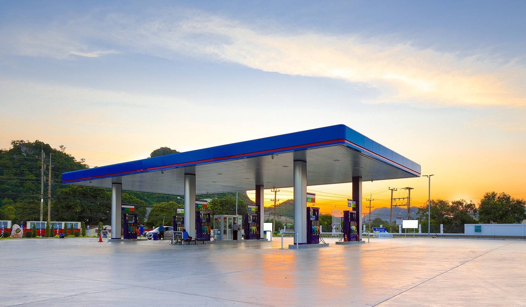 a gas station with a blue roof