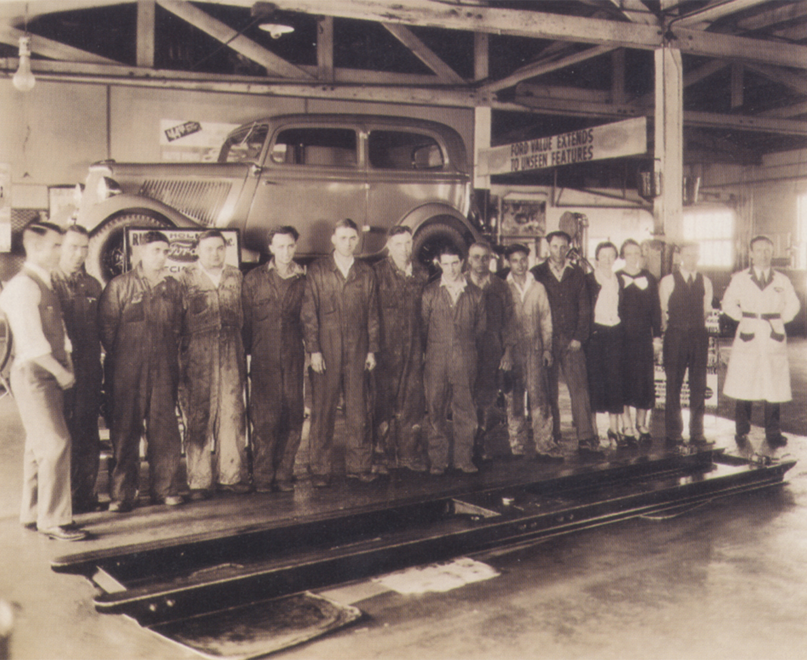 a group of people standing in a garage