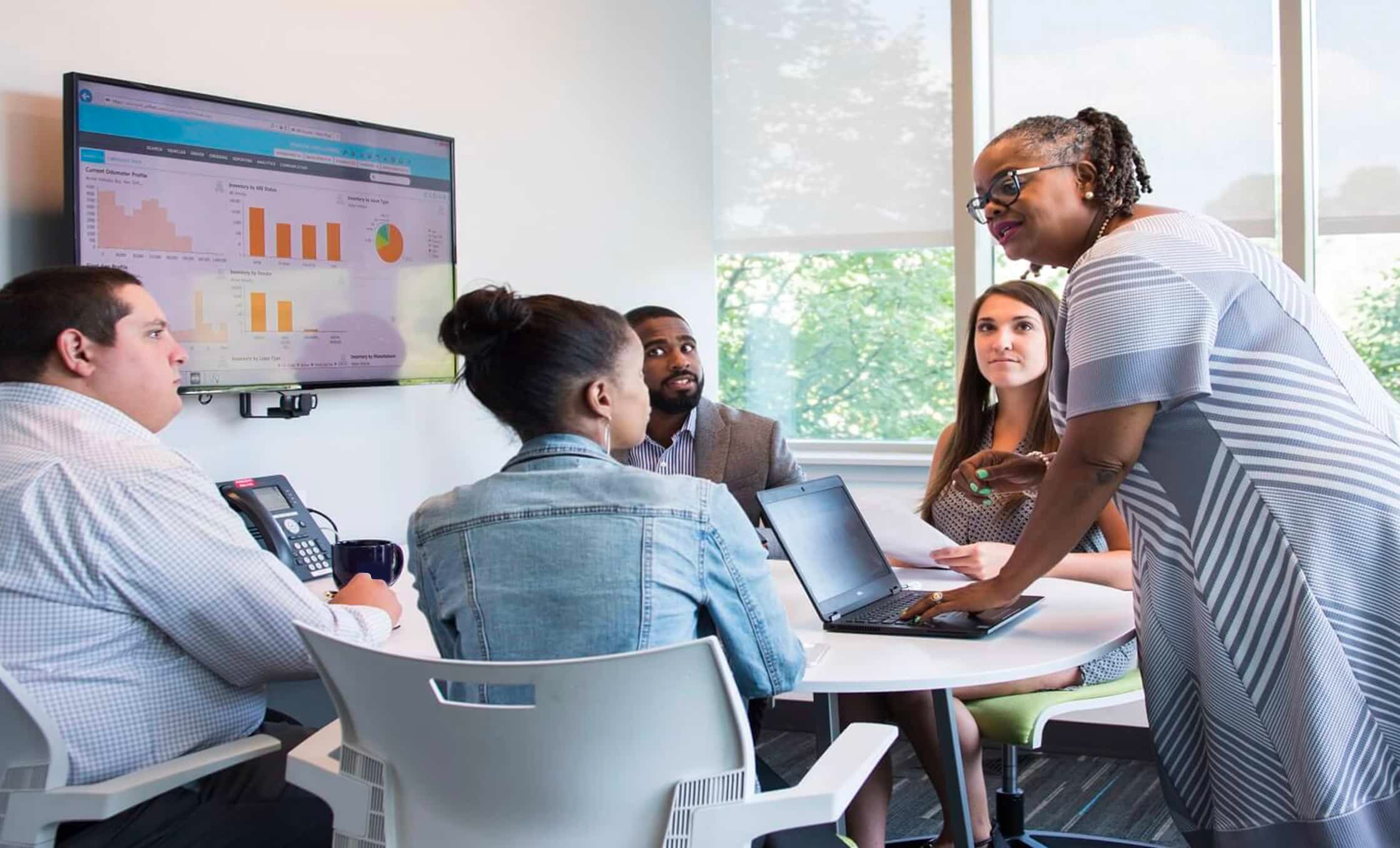 a group of people sitting around a table