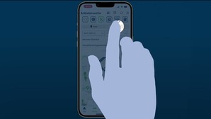 a hand touching a screen