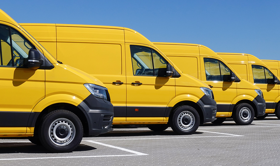 A row of yellow vans
