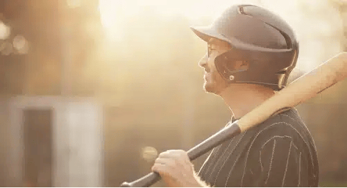 a man holding a baseball bat