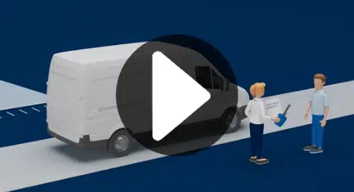 a man standing next to a white truck