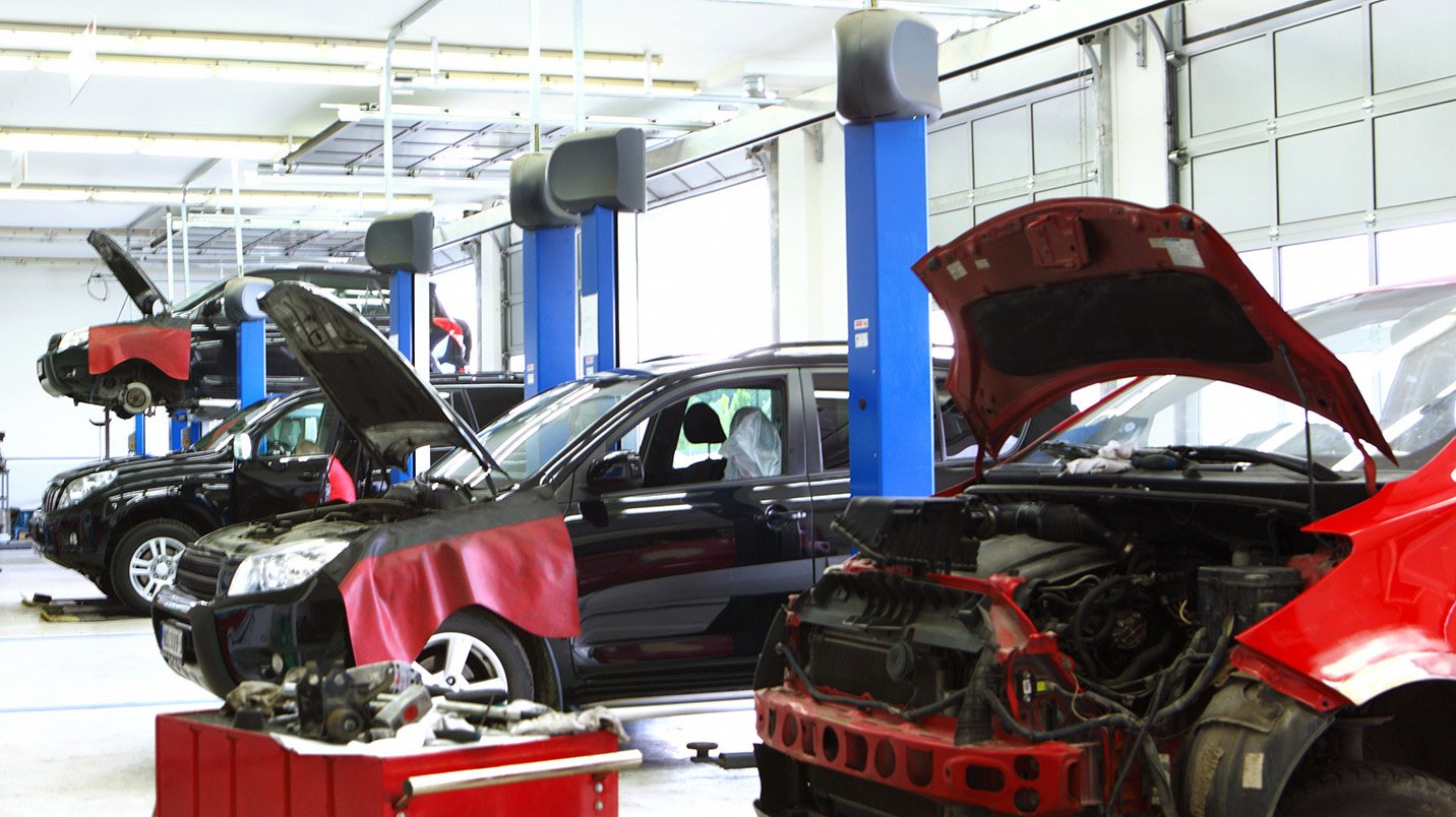 a group of cars in a garage