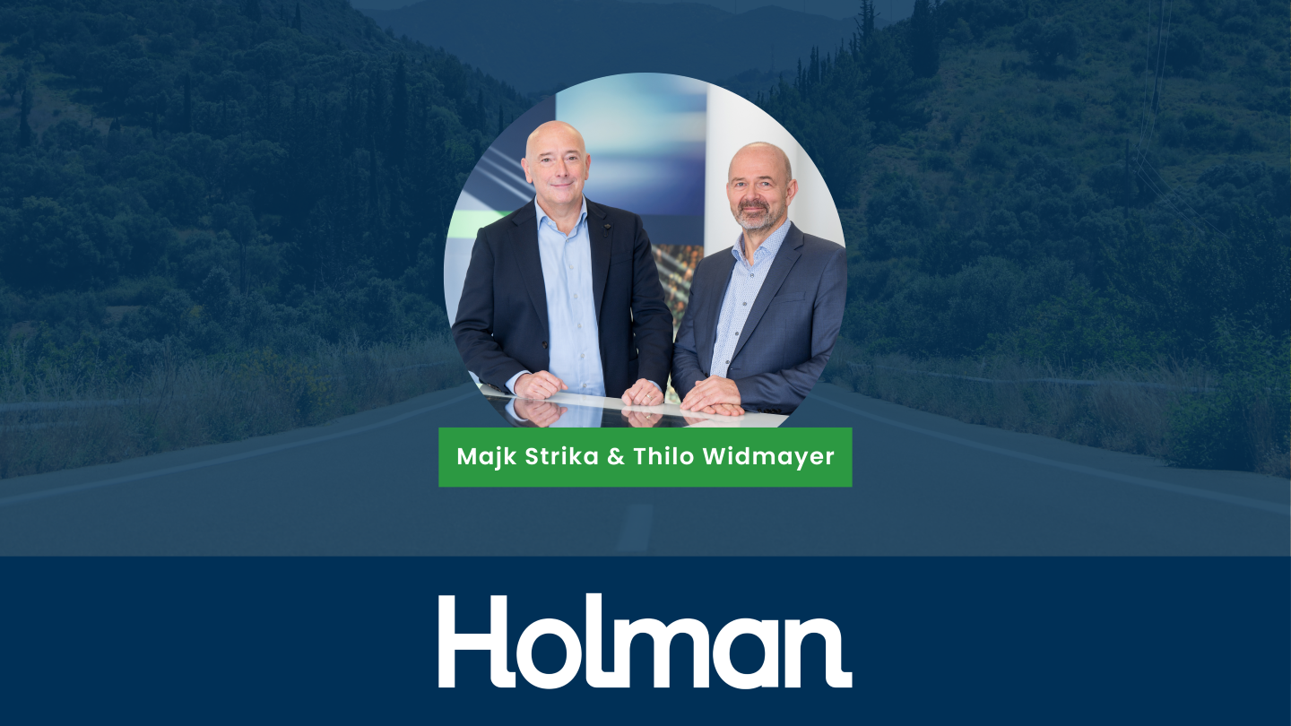 holman's thilo widmayer and majk strika sitting at a desk