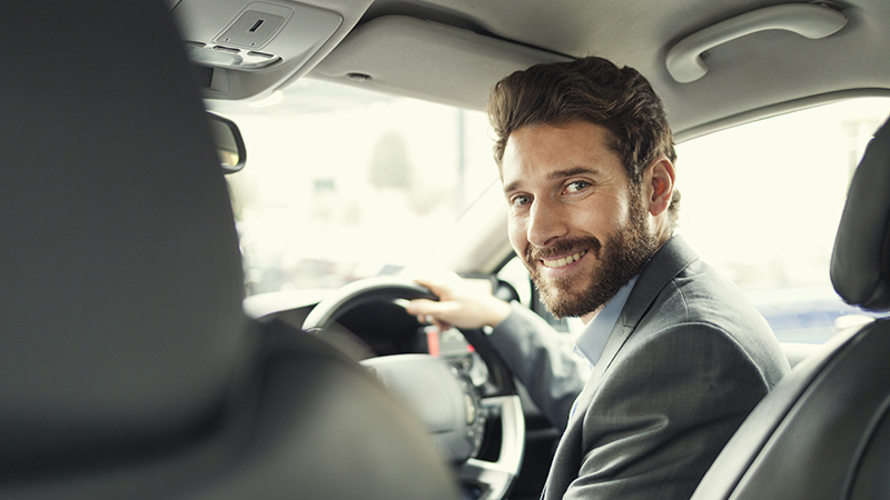 a man smiling at the camera