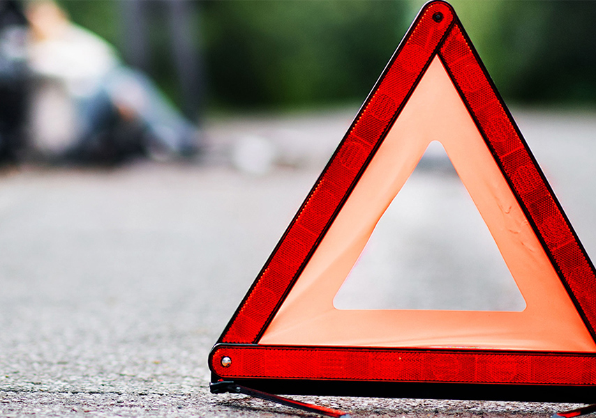 a triangle sign on the ground