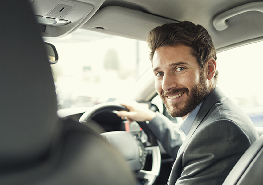 a man smiling at the camera