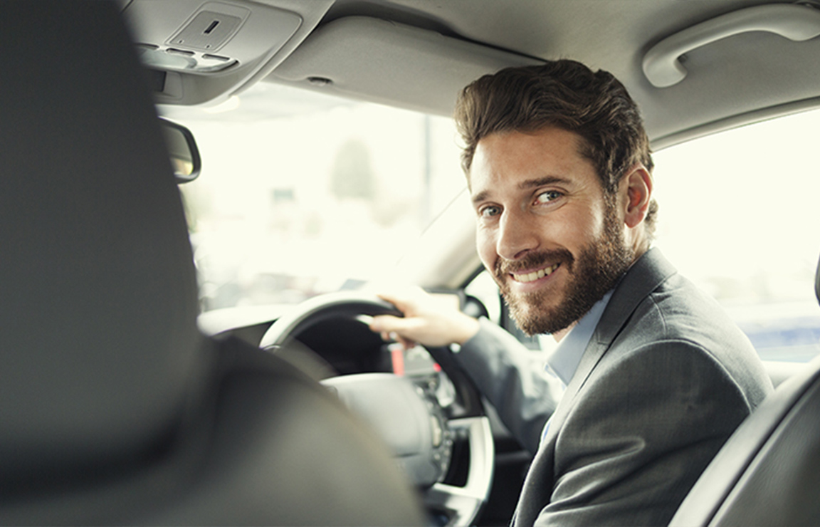 a man smiling at the camera