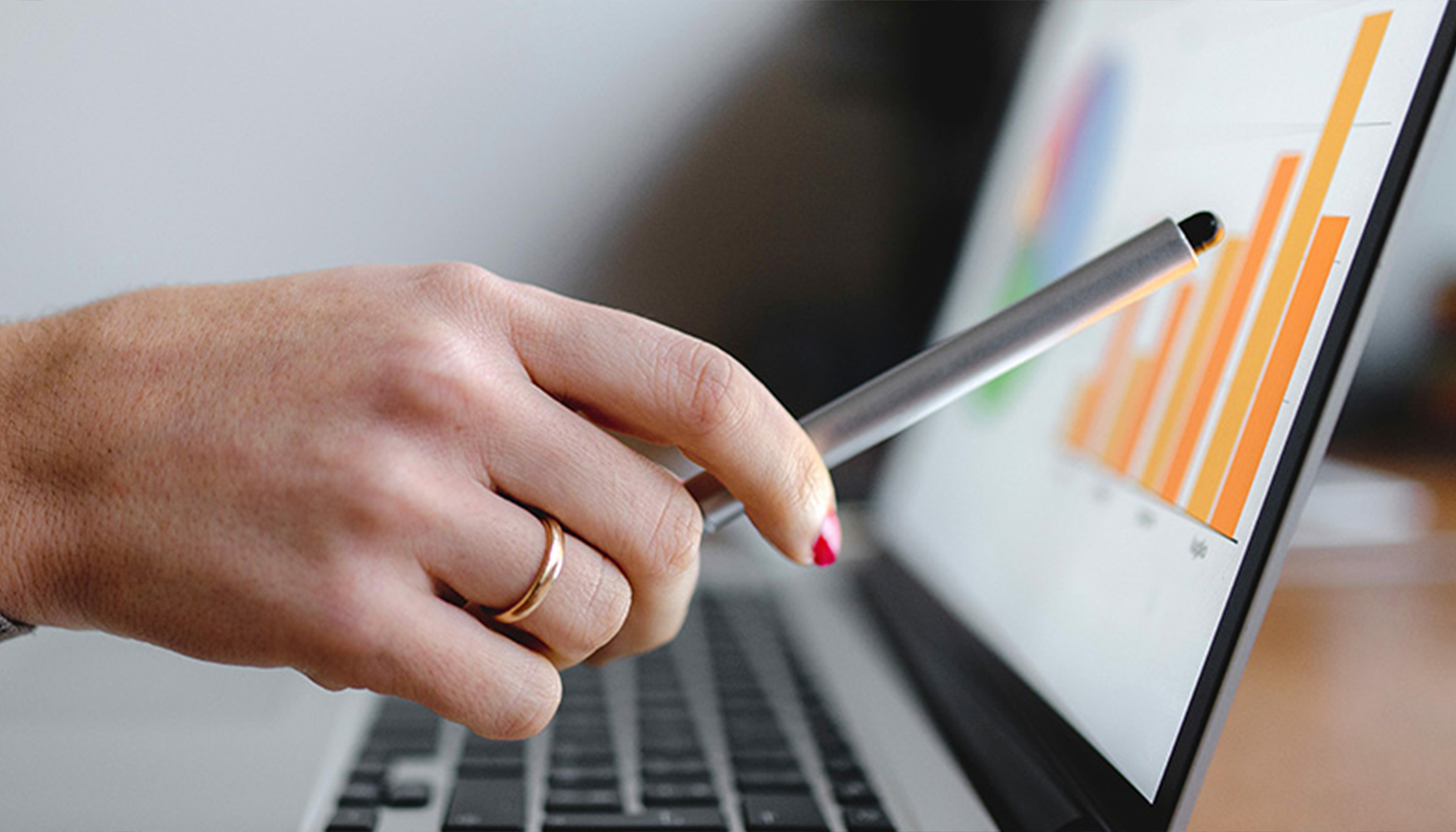 a hand holding a stylus