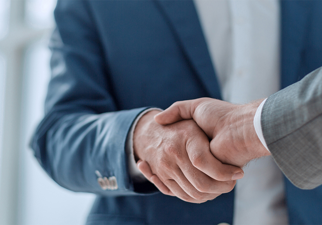 a close-up of a man shaking hands