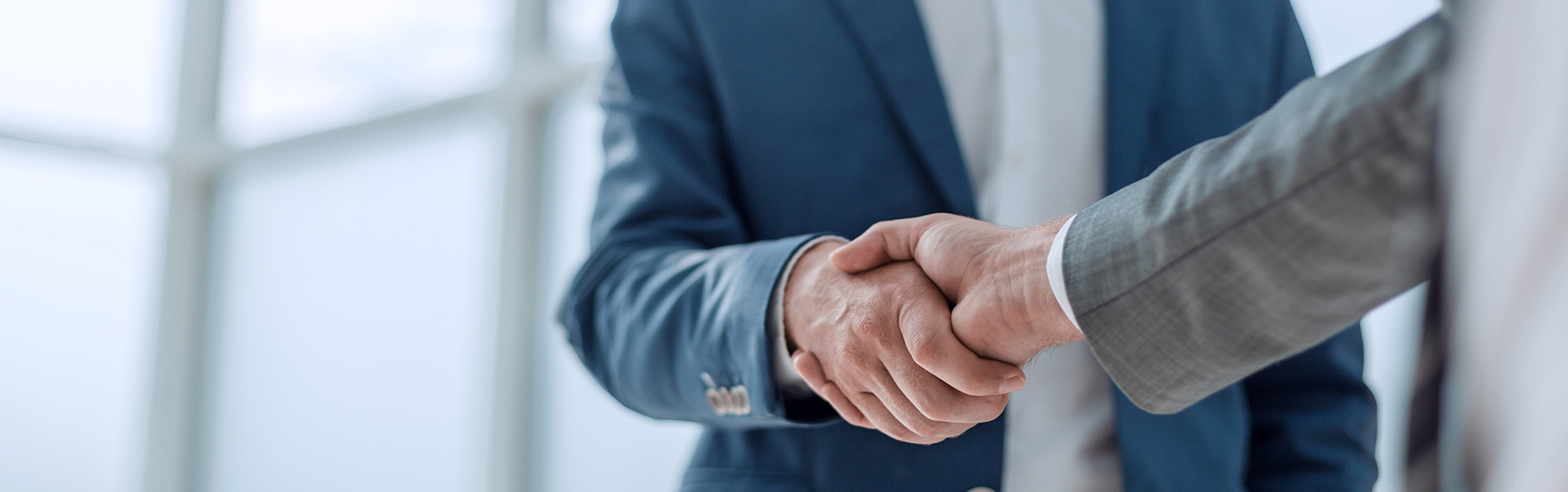 a close up of a handshake