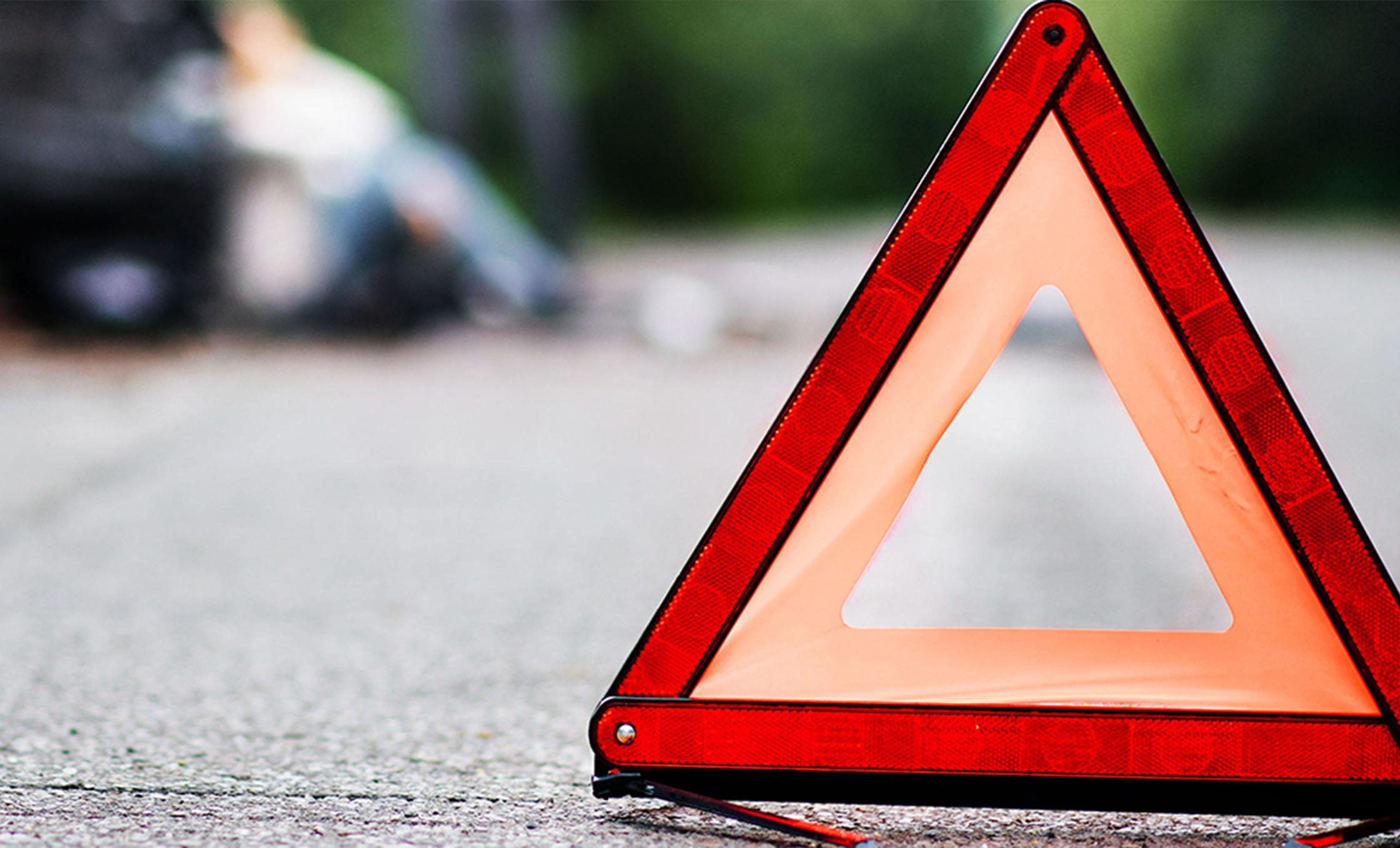 a red triangle sign on the ground