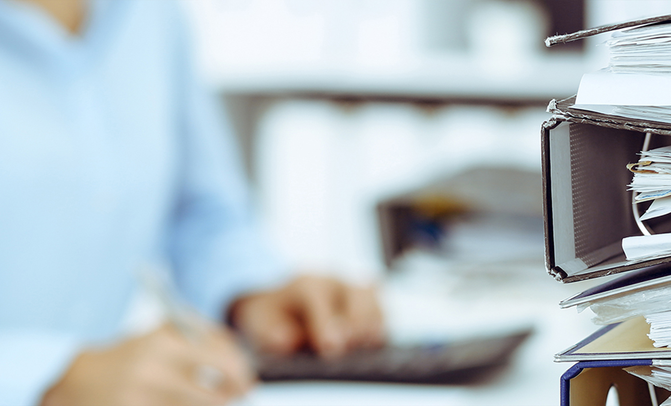 a blurry image of a person using a calculator