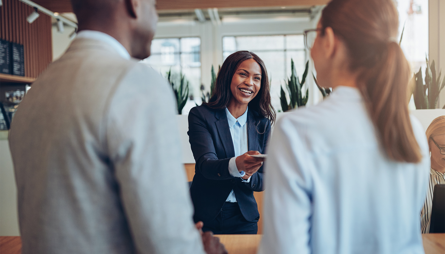 a woman smiling at a group of people
