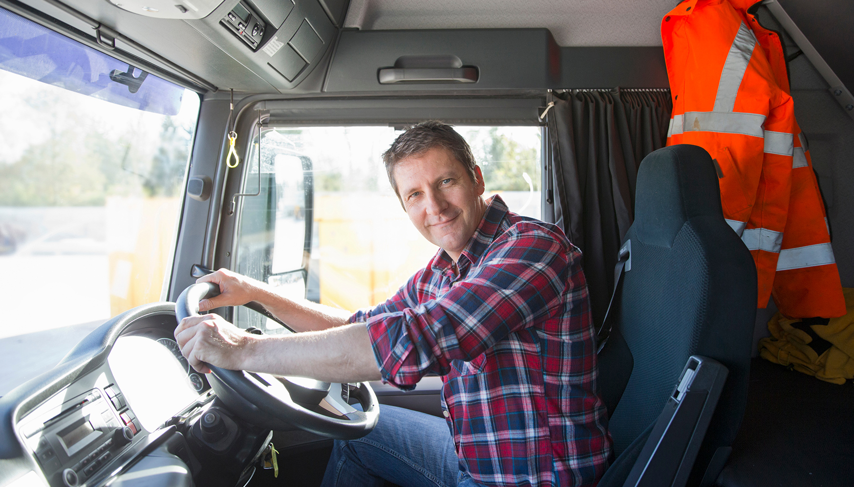 a man driving a truck