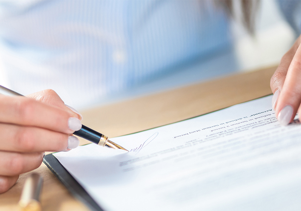a person signing a document