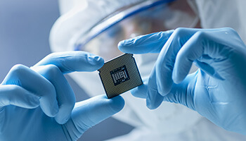 A person holding a semiconductor