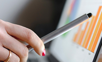 A pen pointing at a computer screen