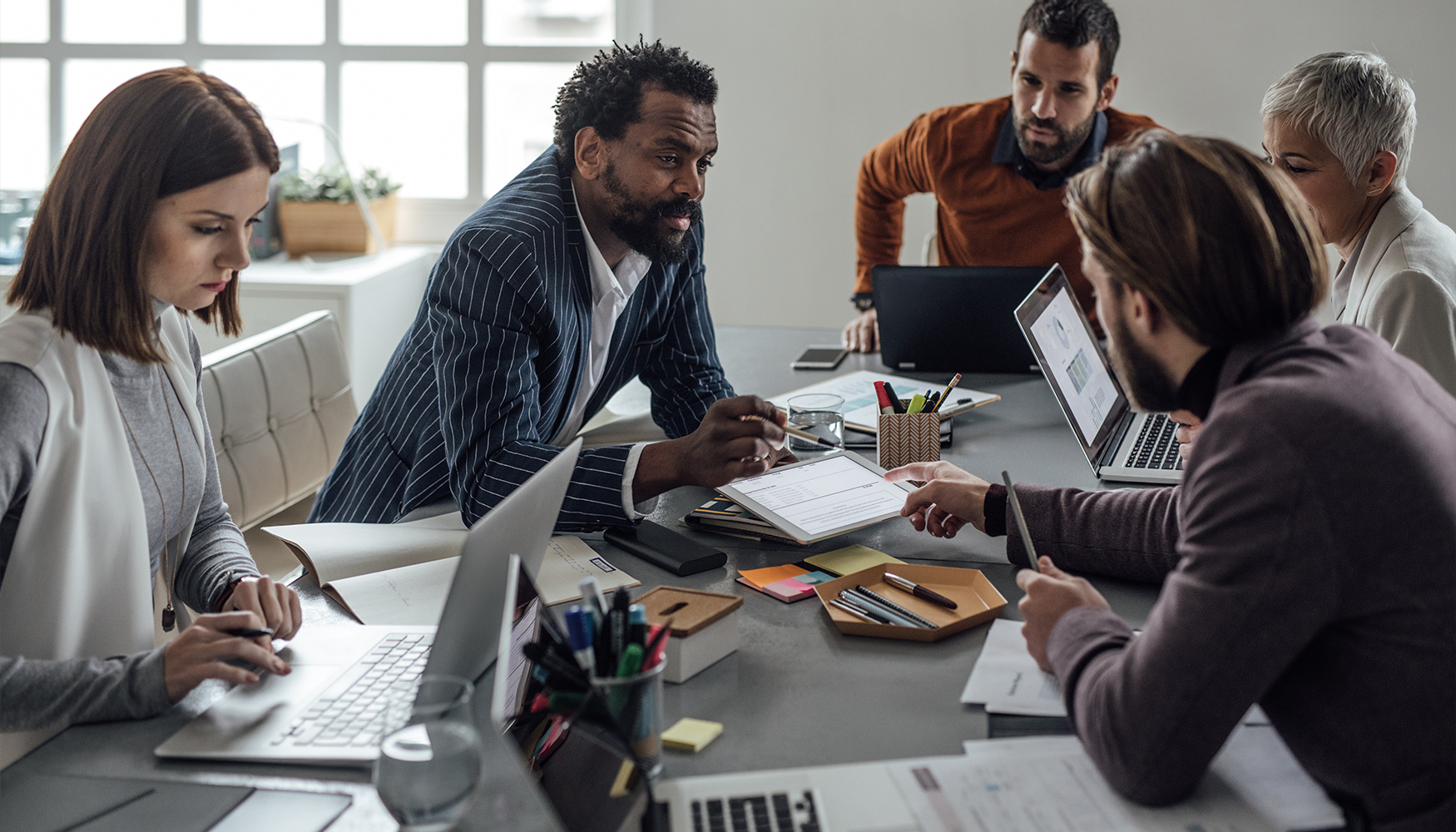 a group of people sitting around a table