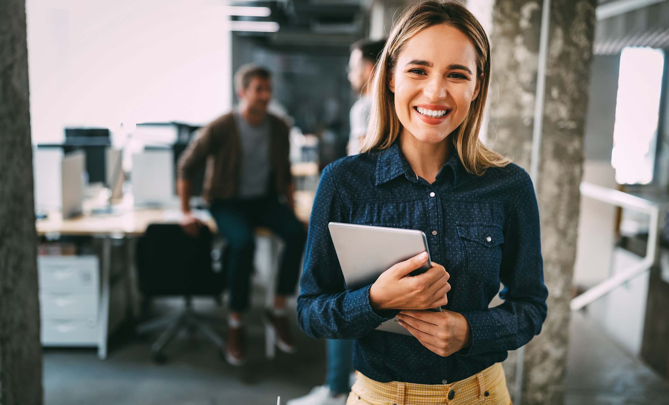 a woman holding a tablet
