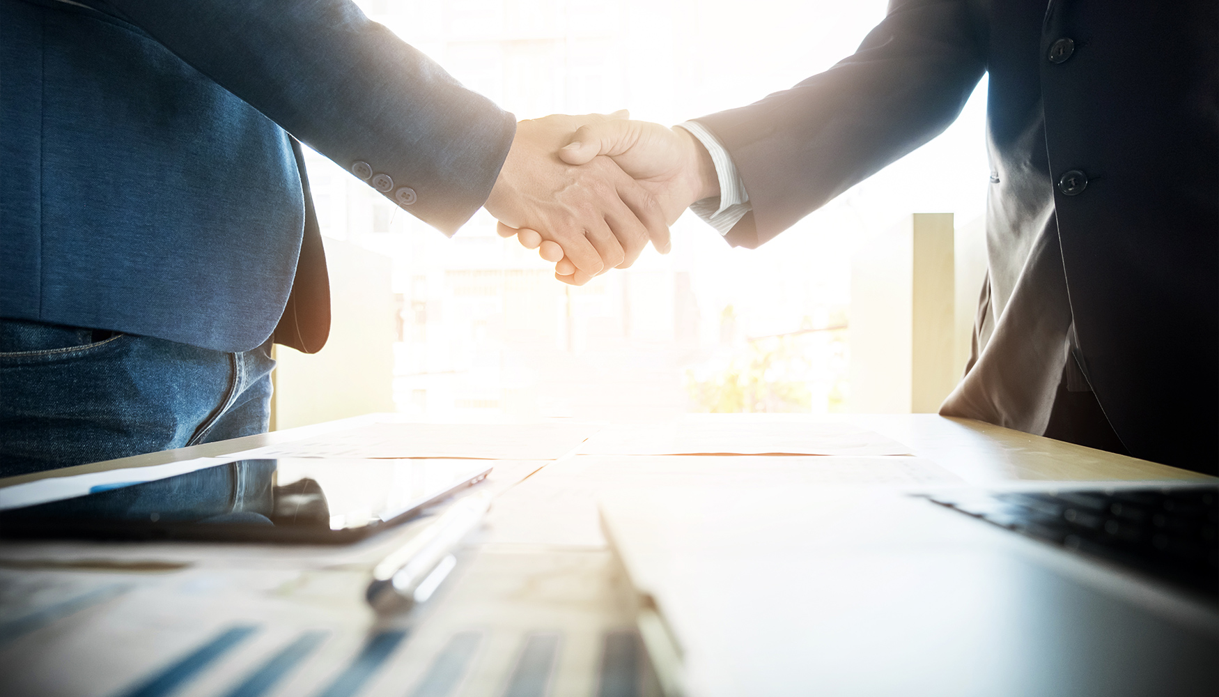 a close-up of people shaking hands