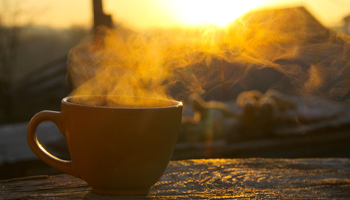 A steaming cup of coffee