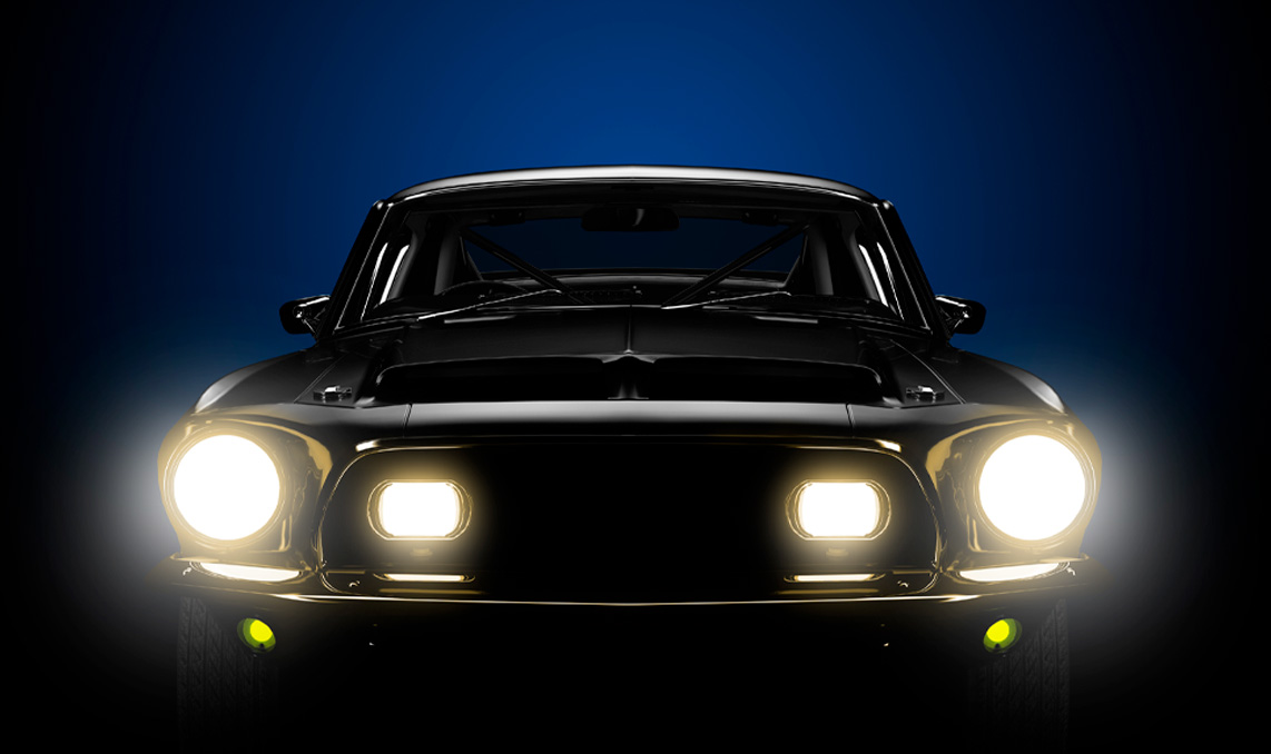 A vehicle with its headlights on in the dark