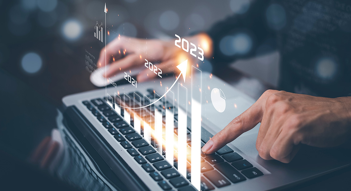 A digital bar chart above a laptop keyboard