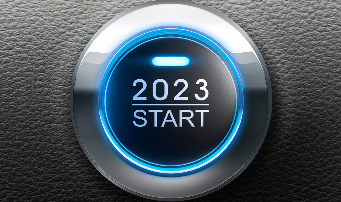 A vehicle's keyless start button that says 2023 Start