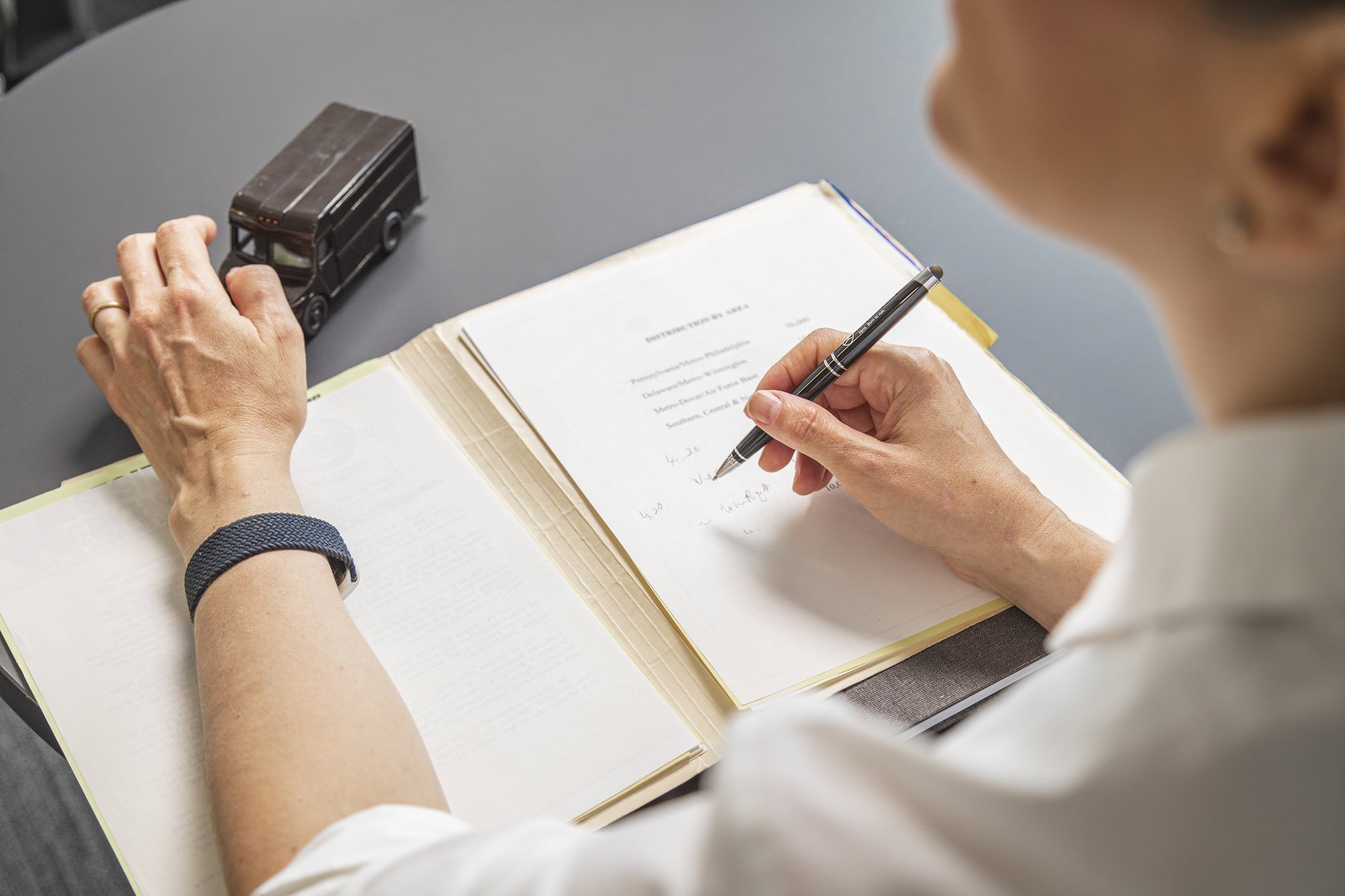 a person writing in a book