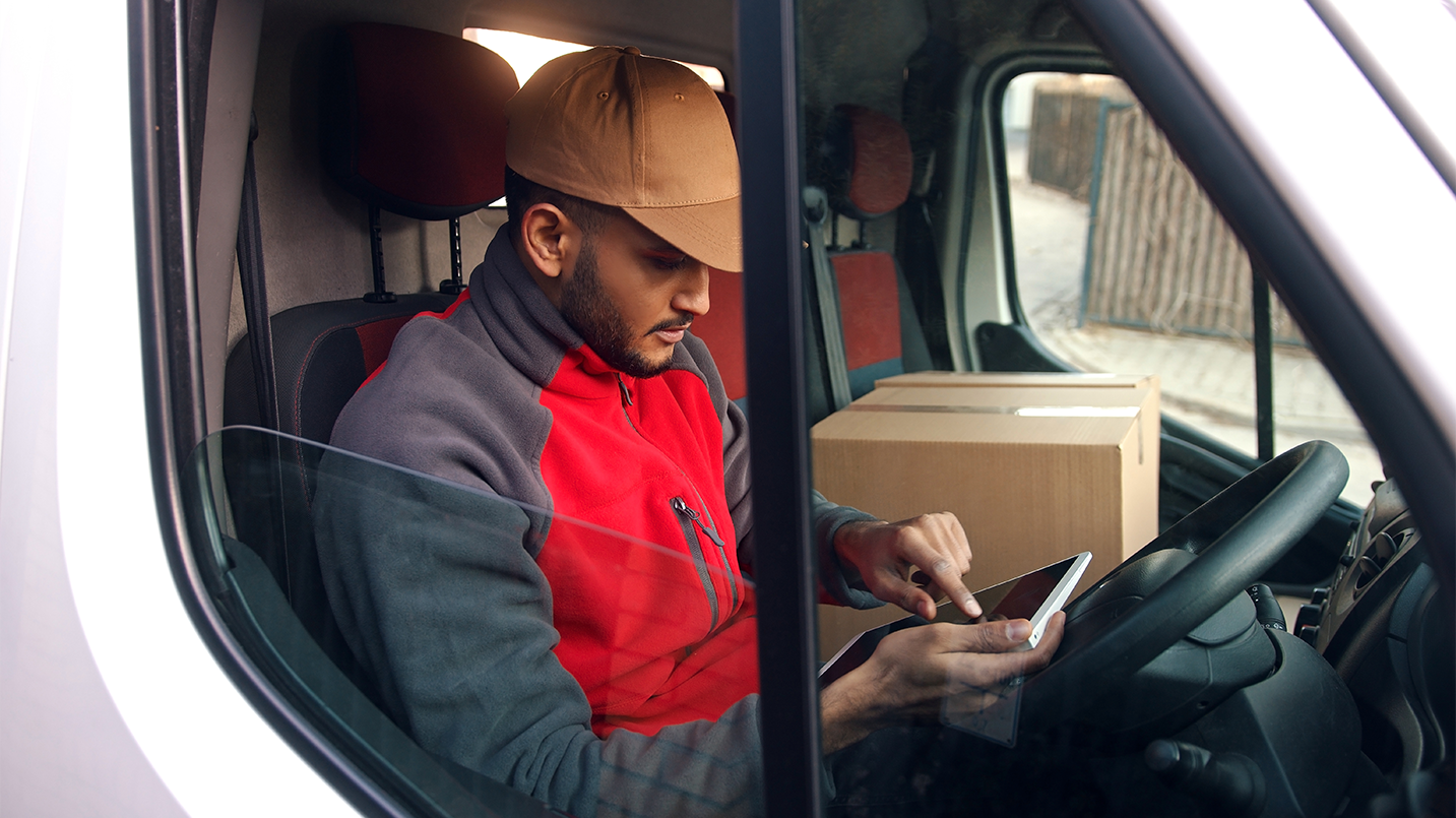 a man in a truck looking out a window