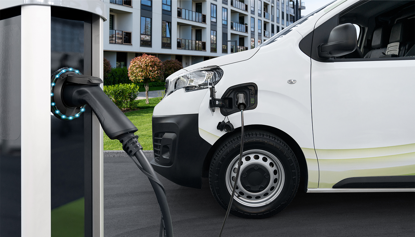 a white car with a black cable plugged into it