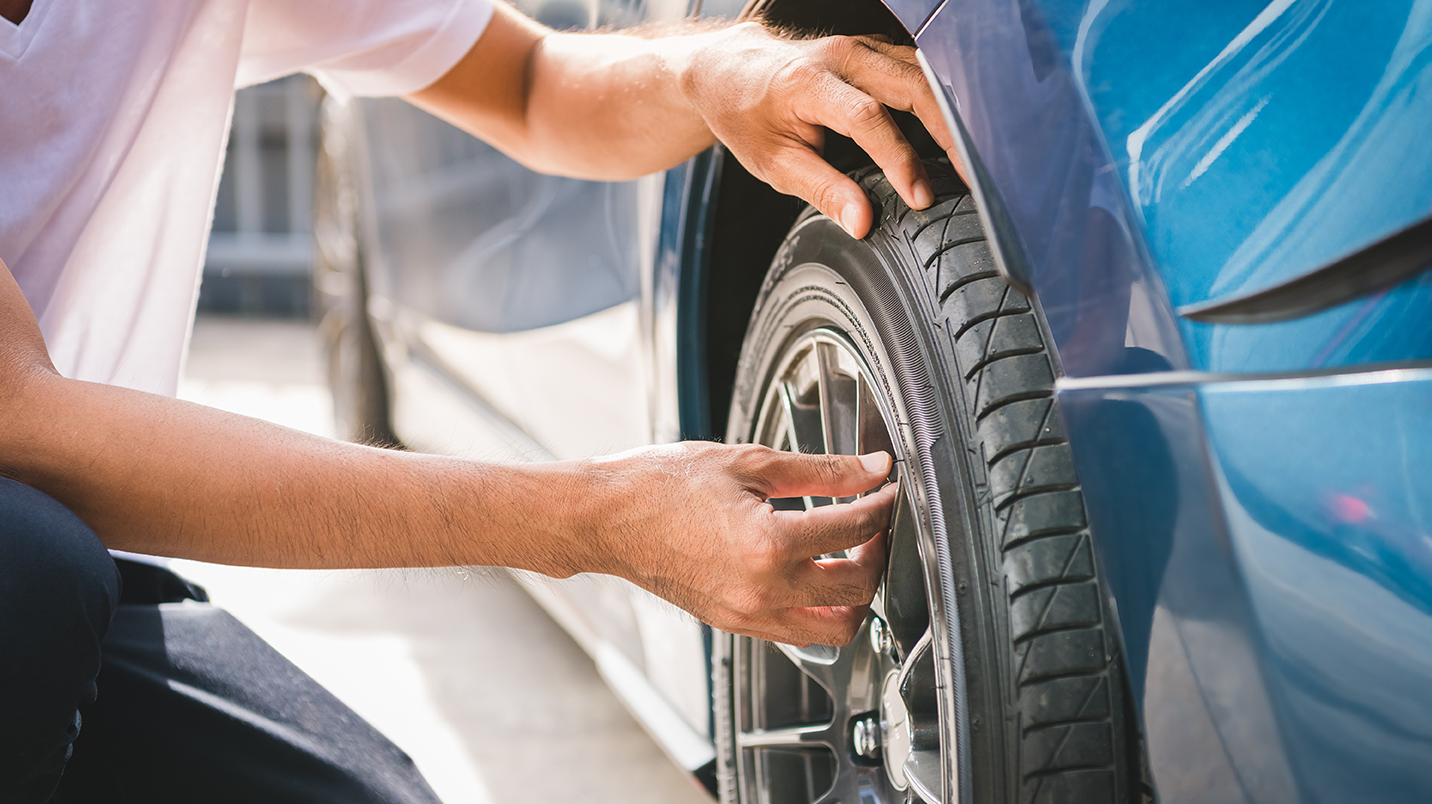 Hands checking a vehicle