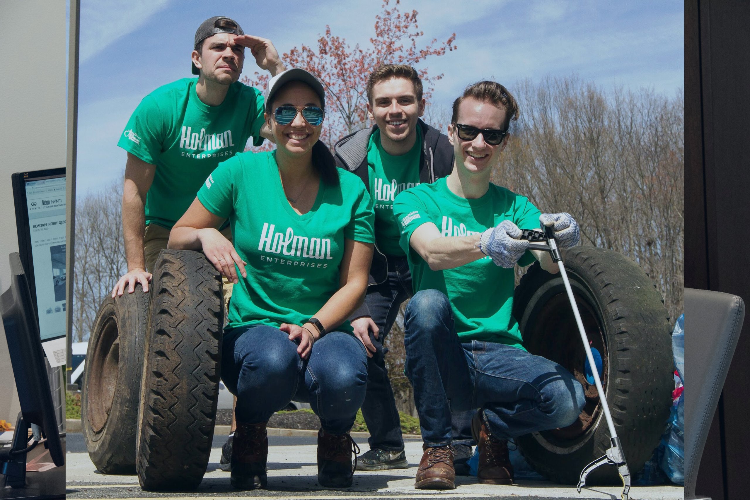 Holman employees in green shirts