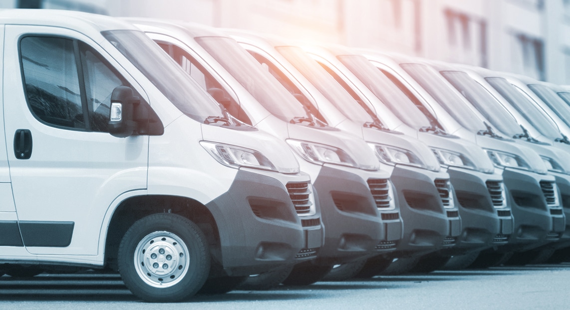 a row of vans parked in a row