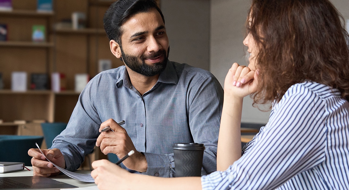 a man and woman sitting at a table