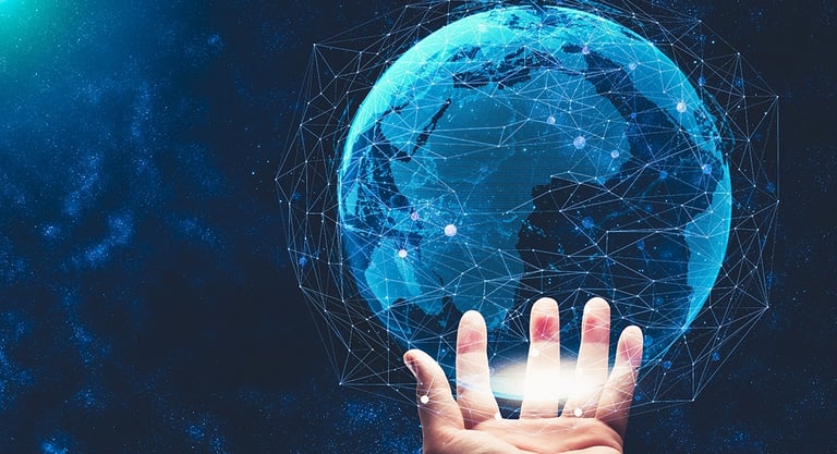 a hand touching a globe