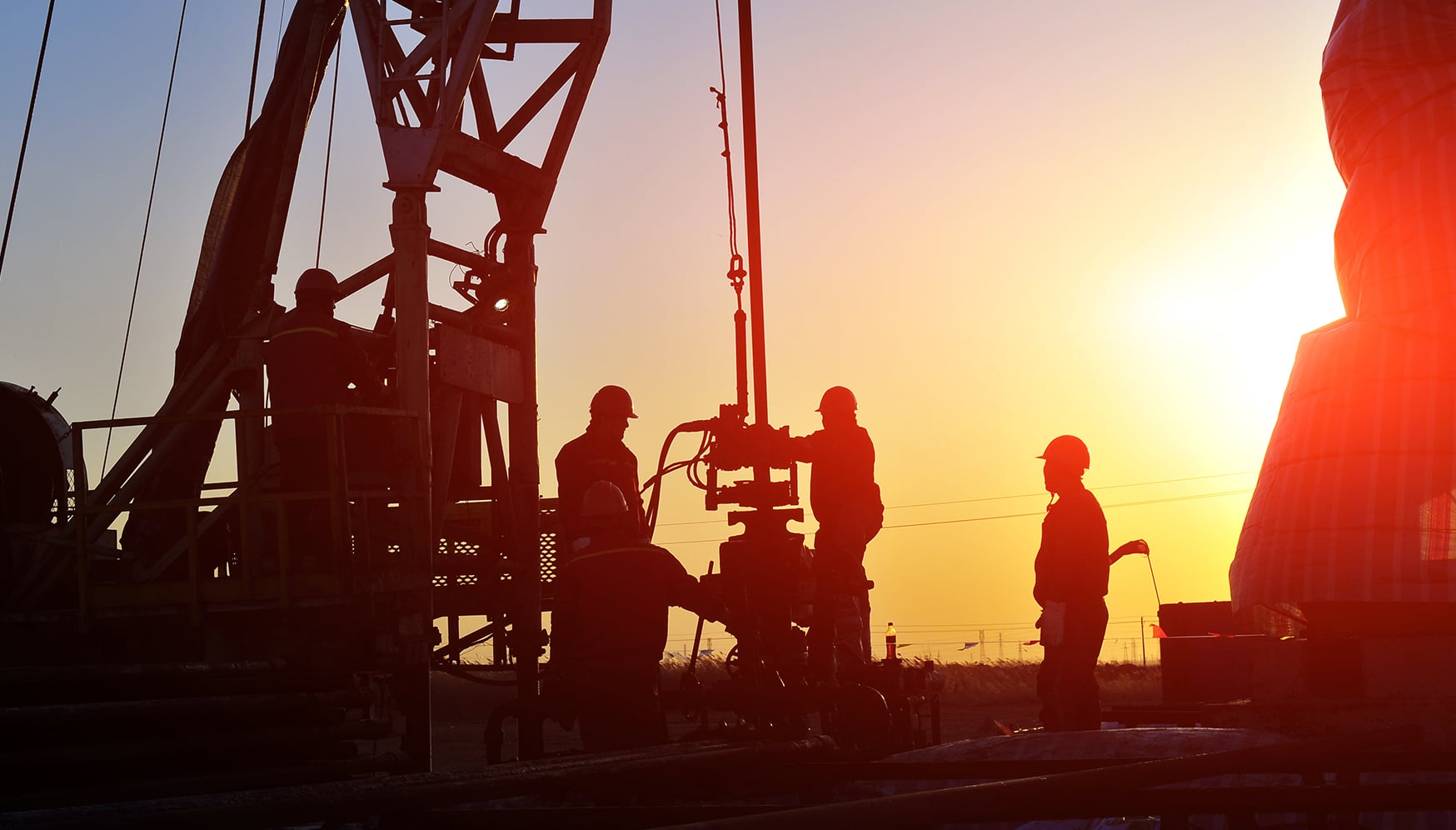 a group of men in hard hats