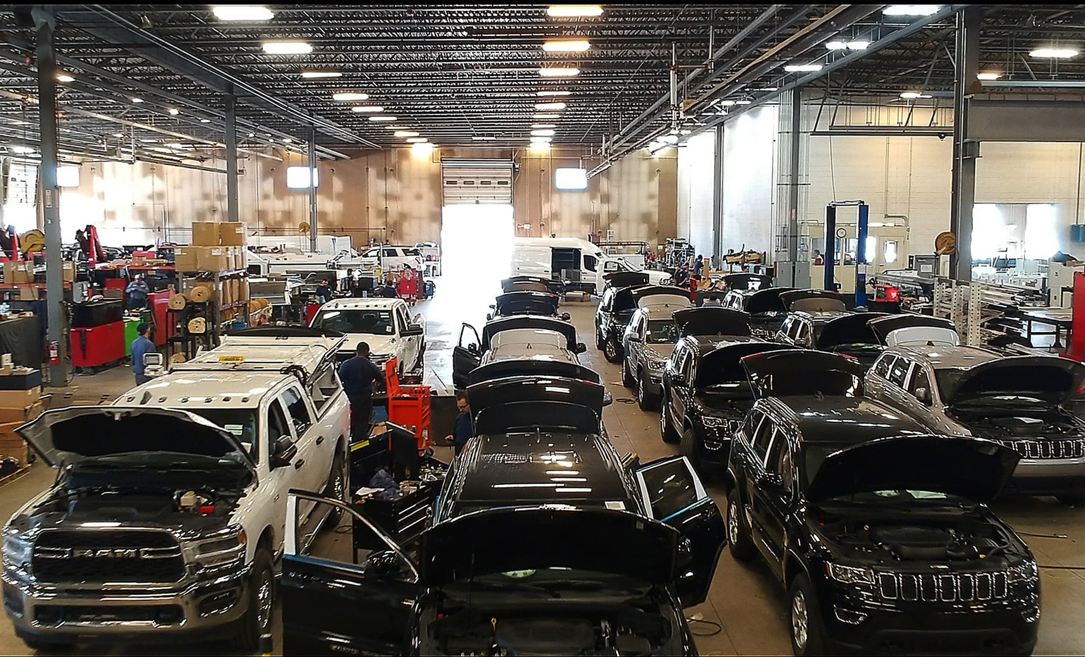 a group of cars in a warehouse