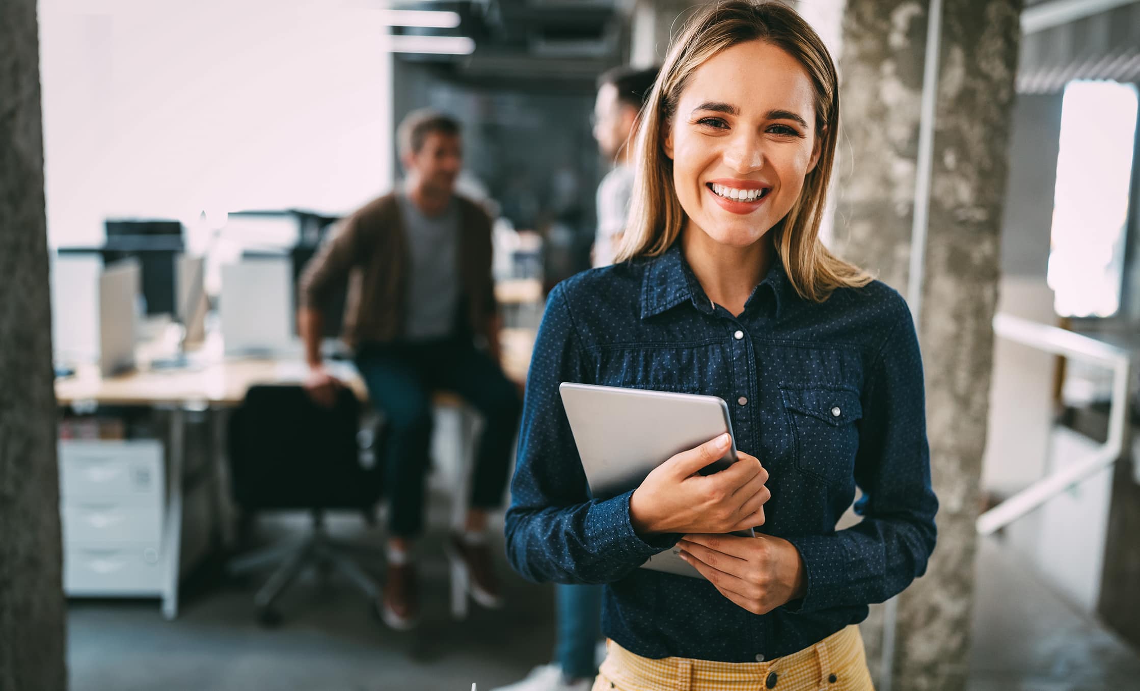 a woman holding a tablet