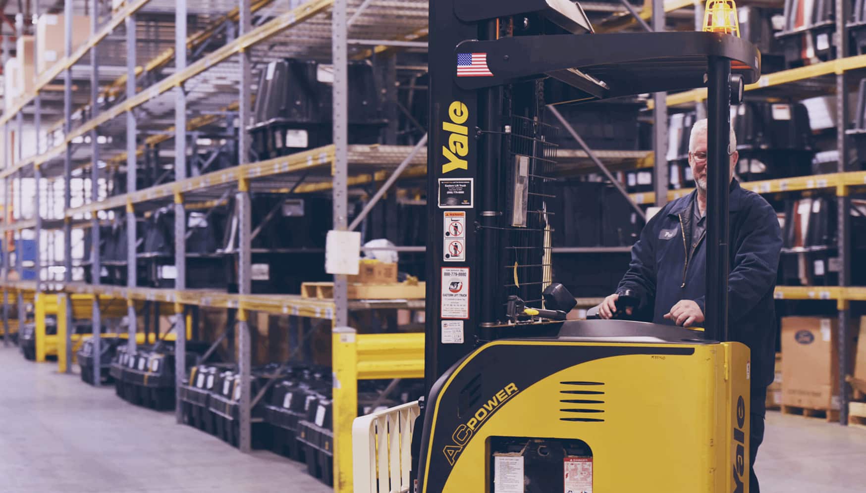 a man standing in a warehouse