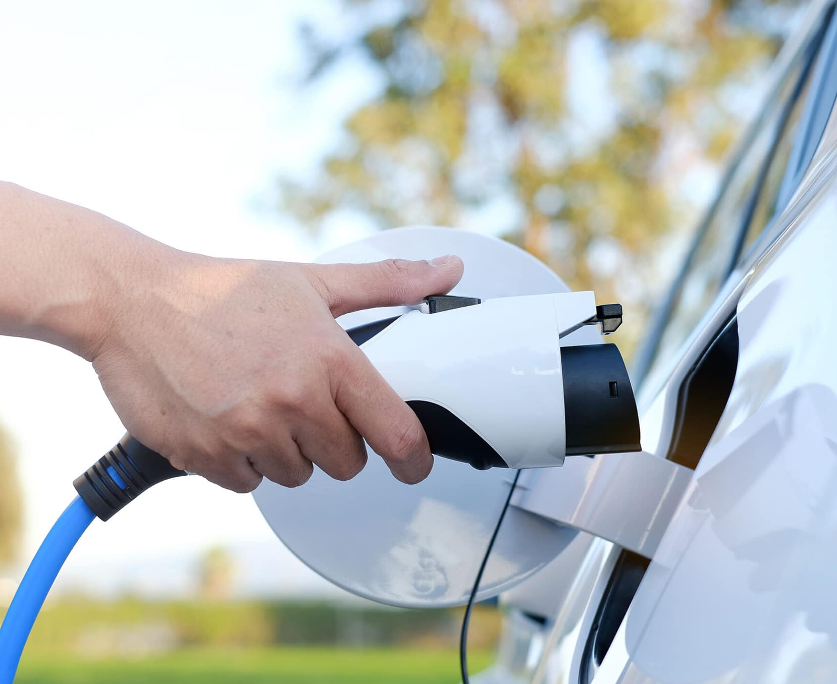a person holding a charging station