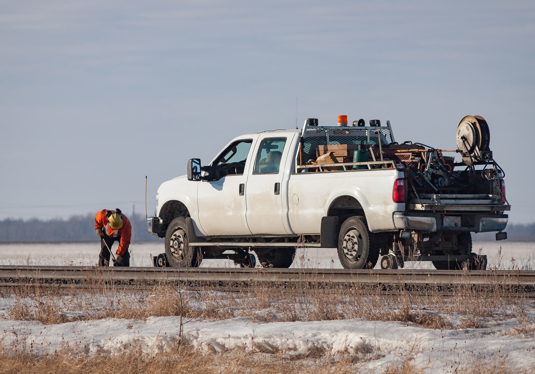 An upfitting truck specialized for railroads on a track
