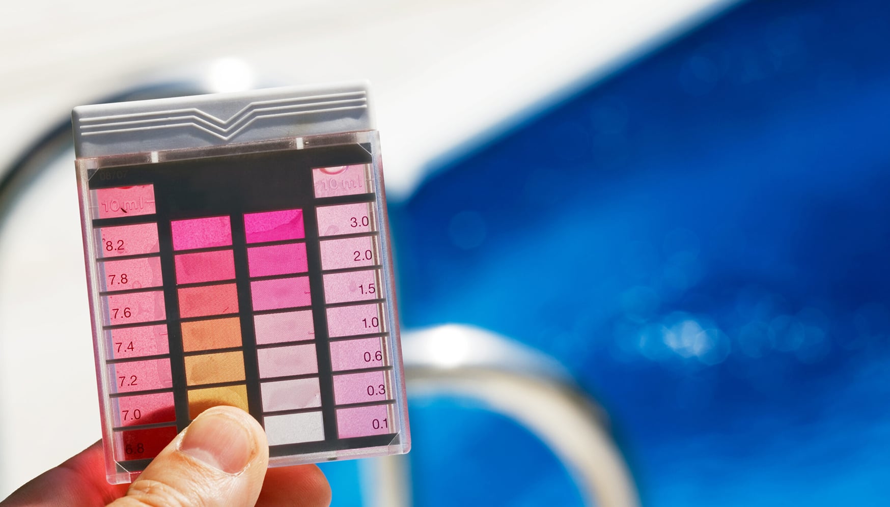 a hand holding a water test