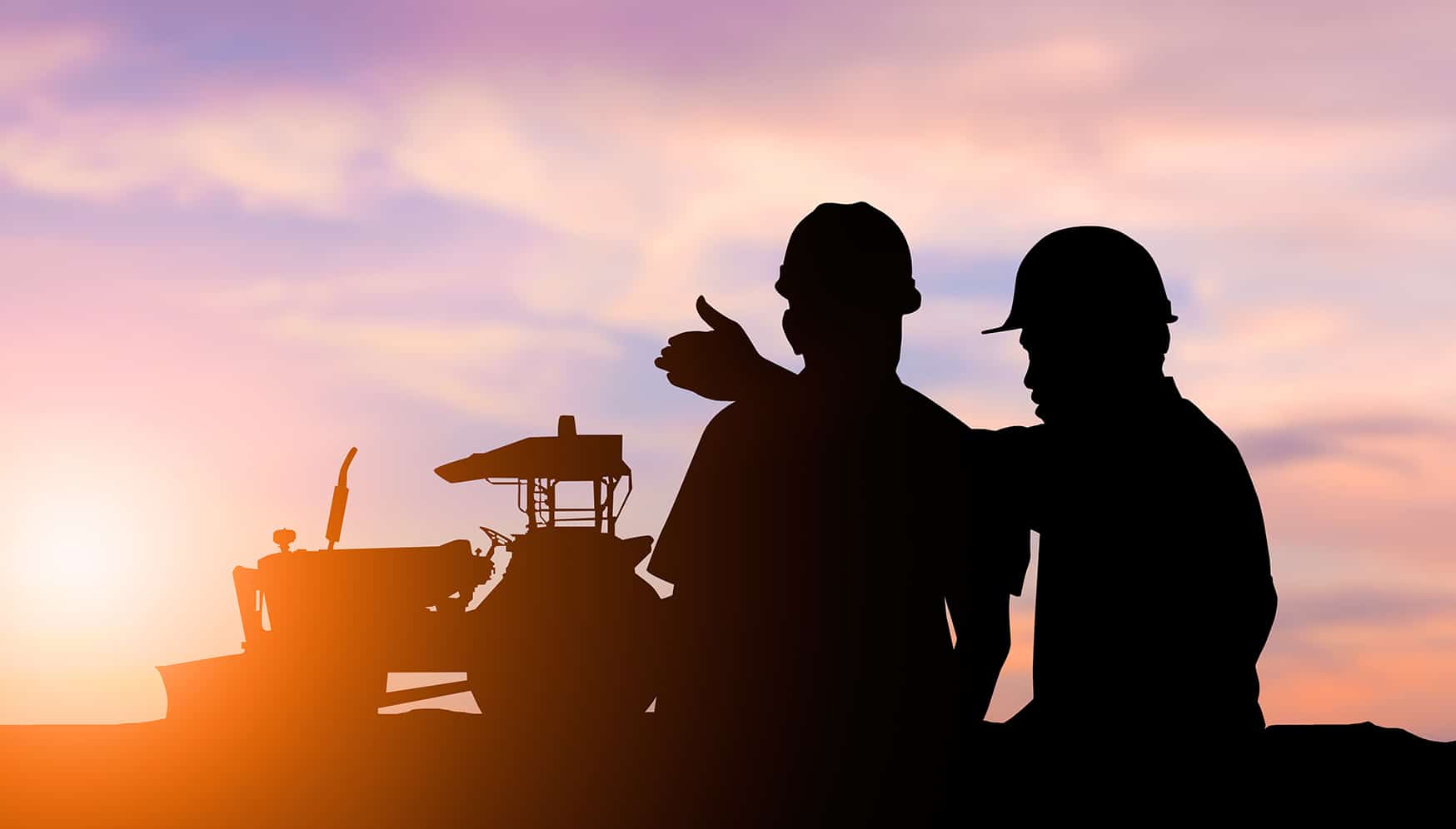 silhouette of men in hard hats