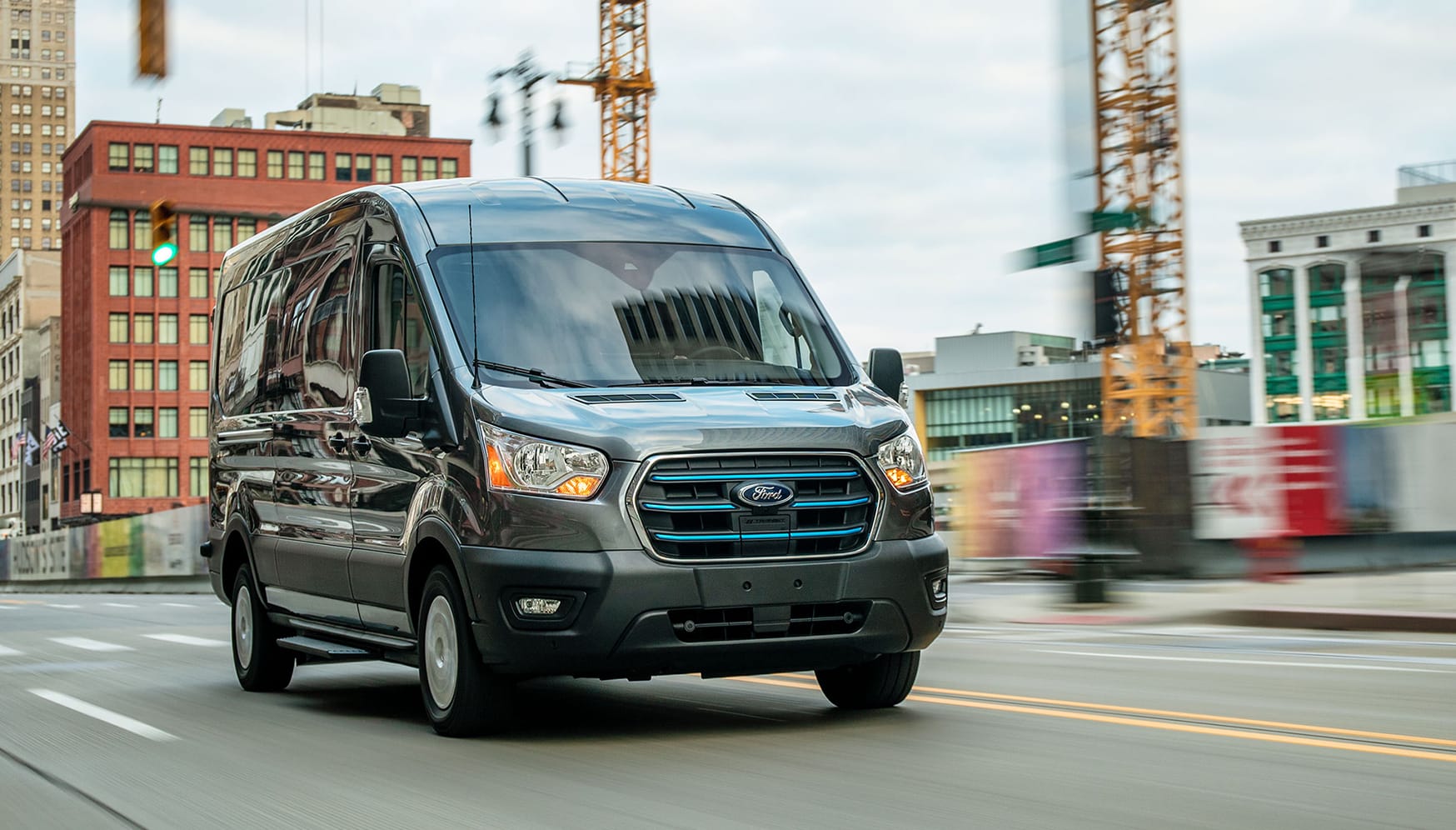 A ford van driving down a road